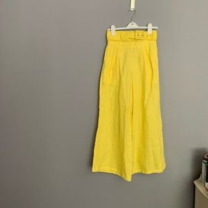 Faithful the Brand yellow linen wide-leg pants.